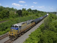 CREX 1524 leads a 163-car CN 377 around a curve through Beaconsfield, with CN 2887 as DPU.