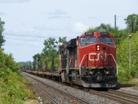 CN X388 with CN 2161 & CN 2236 for power is stopped just west of Dorval Station, awaiting its signal. This train consists of 72 cars for loading windmill blades and will terminate in nearby Taschereau Yard, with the cars continuing to Joffre Yard as part of the consist of CN 400.