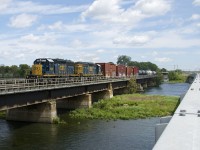 It has been announced today that CN is buying CSX's ex-NYC Montreal Secondary line (running from Valleyfield, Qc to near Syracuse, NY), which will soon put an end to runthrough CSX power in and near Montreal. Always a nice diversion from the usual CN and CP power, here we see CN 327 with a pair of ex-Conrail SD40-2's (CSXT 8831 & CSXT 8849) crossing the Ottawa River. This train will reach CSX rails at Valleyfield and get a CSX crew near the border.
