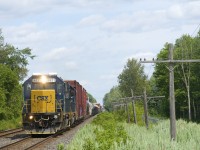 CN 327 has a pair of ex-Conrail SD40-2's (CSXT 8831 & CSXT 8849) as it approaches the Chemin St-Emanuel crossing at MP 33.19 of the Kingston Sub.