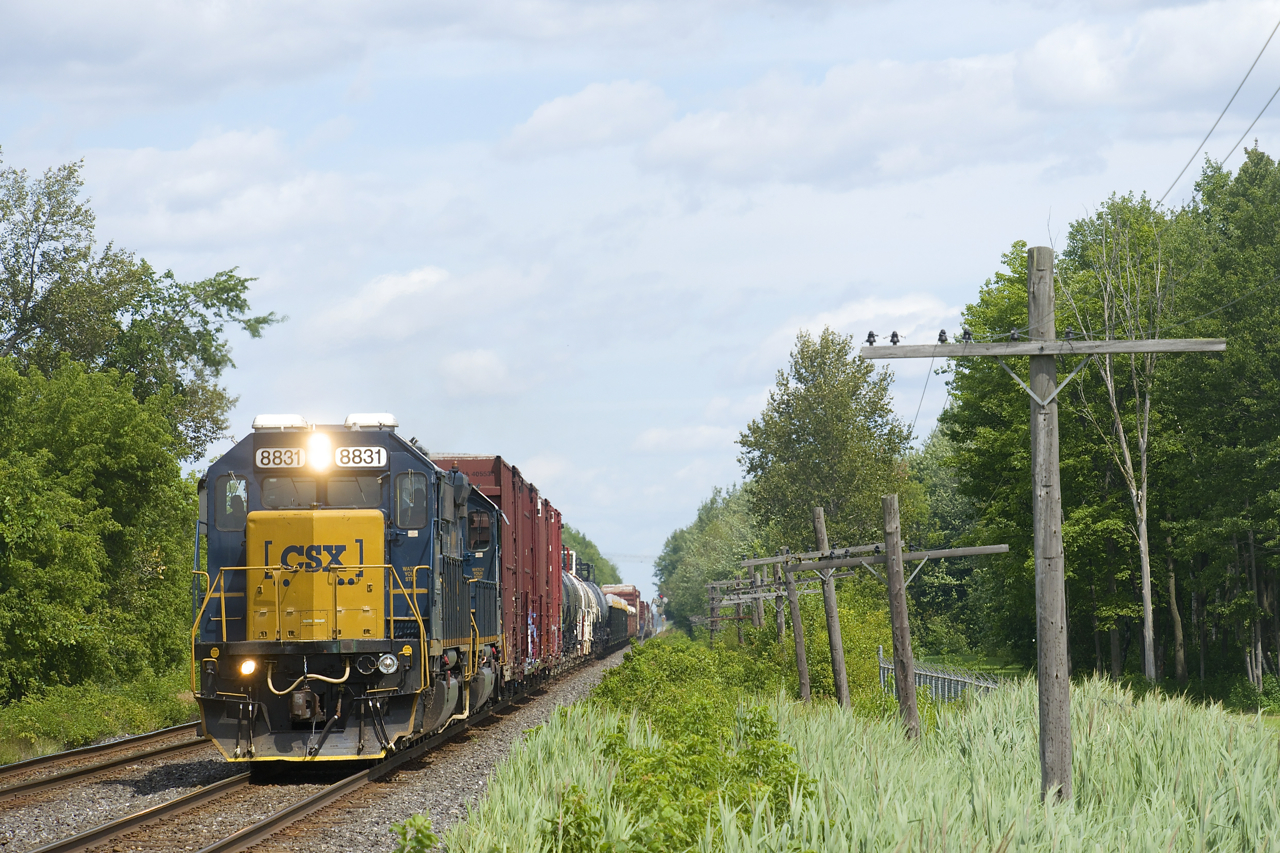 CN 327 has a pair of ex-Conrail SD40-2's (CSXT 8831 & CSXT 8849) as it approaches the Chemin St-Emanuel crossing at MP 33.19 of the Kingston Sub.