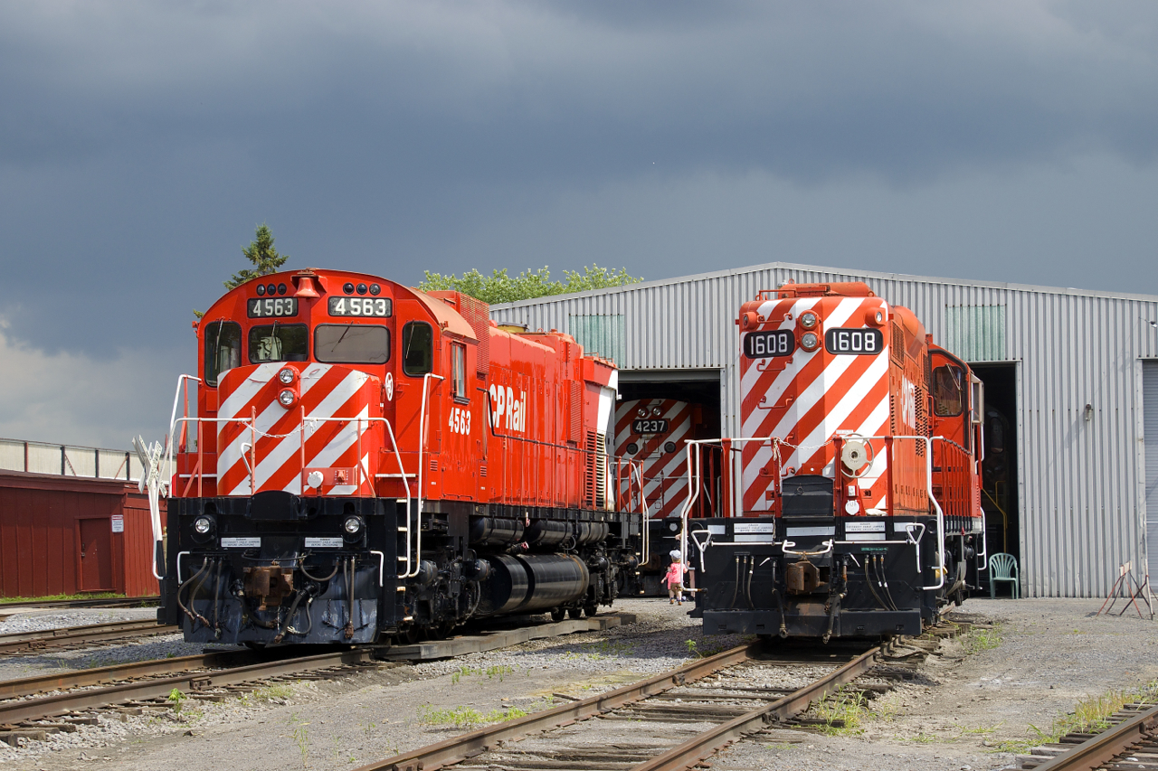 M-630 CP 4563, C-424 CP 4237 (inside the hangar in the background) and GP9 CP 1608 all display what some have dubbed 'candy cane stripes' as they get a bit of sun at Exporail on a mostly cloudy day.