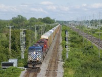 Empty ethanol train CP 651 has a ut of 49 autoracks up front (and 94 tank cars behind) as it splits a set of signals on CP's Vaudreuil Sub just before it leaves the island of Montreal. Power is CEFX 1058, CP 9732 & CP 8060.