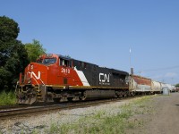 CN 527 with a single ES44AC for power (CN 2810) is backing up as it does its lift and set-off at Pointe St-Charles Yard. It is crossing over from the north to the south track.