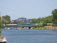 VIA 6424 leads VIA 635 over the Lachine Canal as numerous pleasure boats pass underneath.