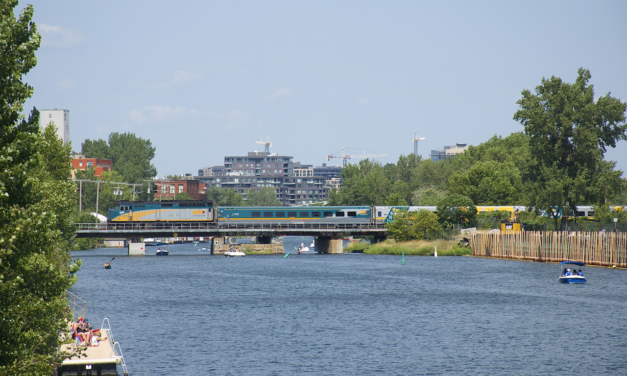 VIA 6424 leads VIA 635 over the Lachine Canal as numerous pleasure boats pass underneath.