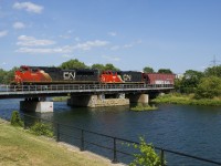 CN 527 with CN 8849 & CN 9591 for power advances over the Lachine Canal after dropping off part of his train on the Butler Spur. Soon he will be back up over the canal with cars to both set off and lift in Pointe St-Charles Yard before he heads to Taschereau Yard.