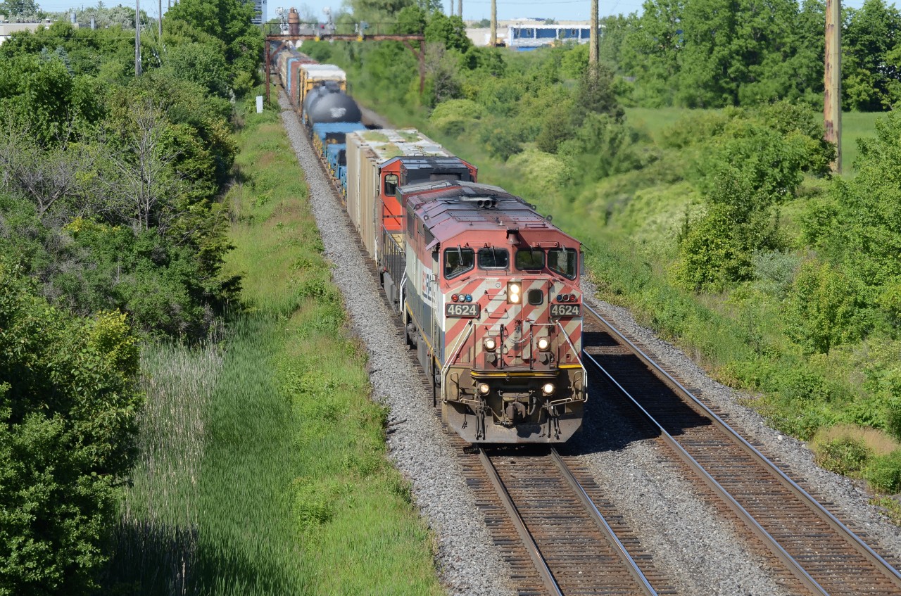 CN 435 eases it’s train into Aldershot with the dynamic brakes in full force with a BC Rail on point