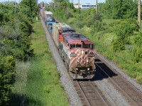 CN 435 eases it’s train into Aldershot with the dynamic brakes in full force with a BC Rail on point 