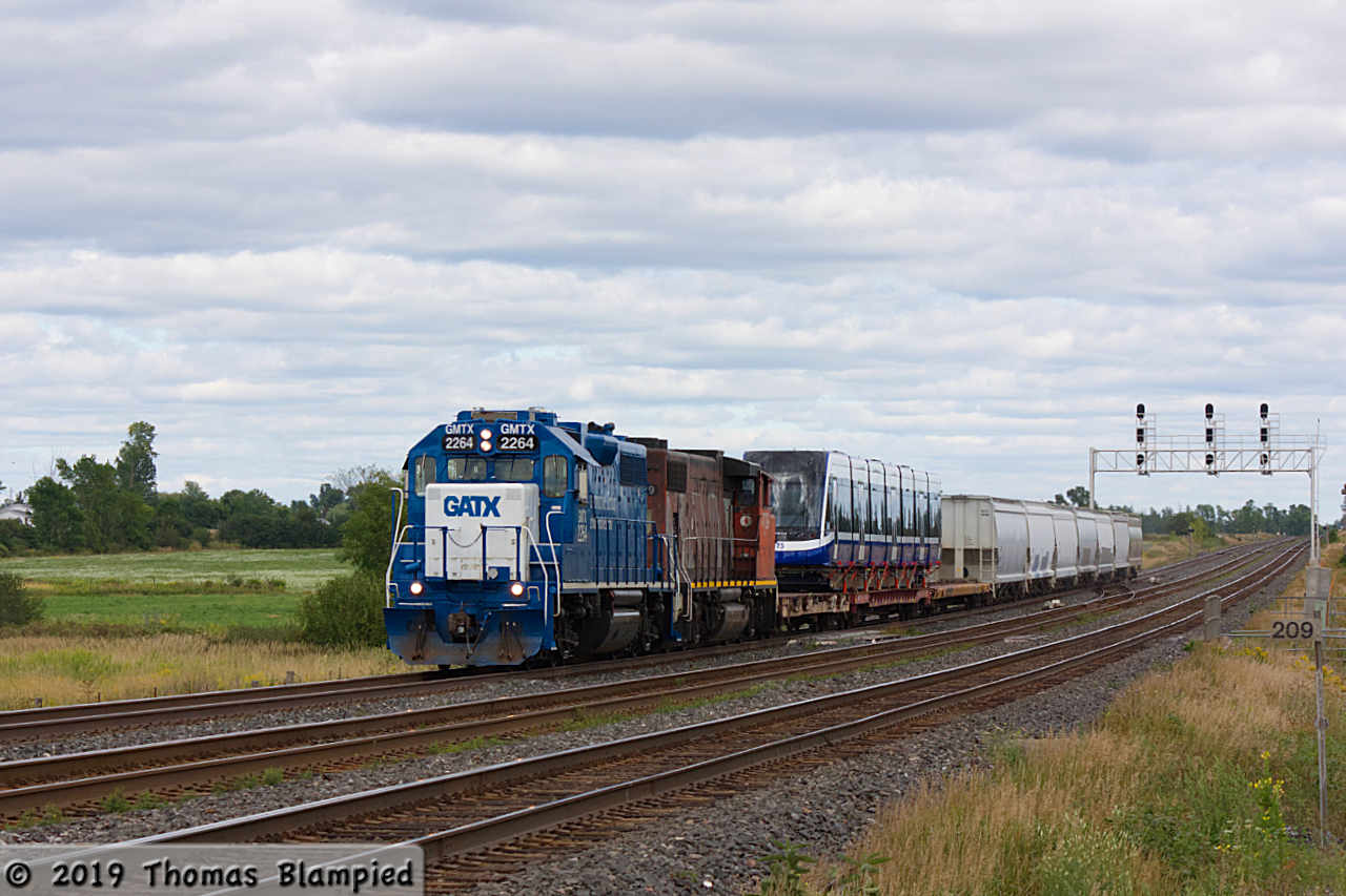 GMTX 2264 and CN 4789 power through Marysville with a new light rail train for Edmonton in tow.