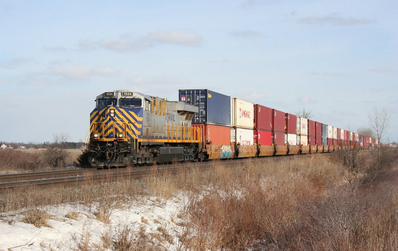 A leased Citrail ES44DC leads train 117, a re-routed container train from the northern transcontinental line into Sarnia, ON.
