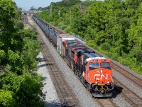 Sarnia-bound 383, with CN 3877 on point with the infamous CN 100 logo on the side, rolls through Aldershot on Canada Day. With most trains detouring over the Chatham and Grimsby/Stamford Subs at the time due to the derailment in the Sarnia tunnel, 383 was handling most, if not all, of the Sarnia traffic at the time (not sure if 509 was still running or not - and would appreciate confirmation one way or another if anyone knows). Marc Dease <a href="http://www.railpictures.ca/?attachment_id=38117">shot</a> this train in Sarnia later that night.