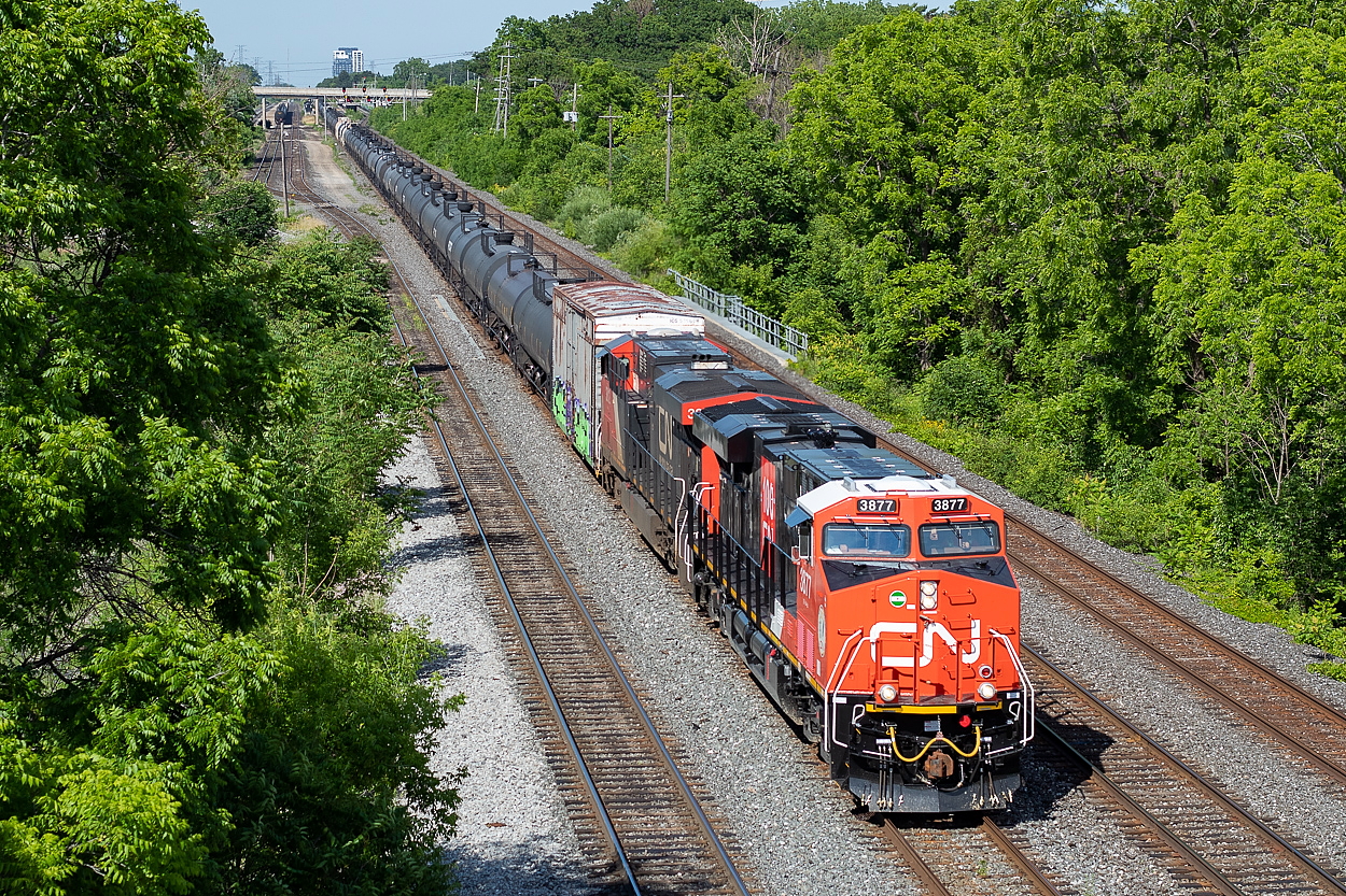 Sarnia-bound 383, with CN 3877 on point with the infamous CN 100 logo on the side, rolls through Aldershot on Canada Day. With most trains detouring over the Chatham and Grimsby/Stamford Subs at the time due to the derailment in the Sarnia tunnel, 383 was handling most, if not all, of the Sarnia traffic at the time (not sure if 509 was still running or not - and would appreciate confirmation one way or another if anyone knows). Marc Dease shot this train in Sarnia later that night.
