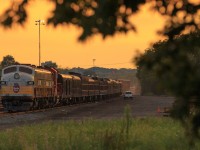 The Golden hour. The RCP is back in town, but this time for the CP women's open golf tournament hosted in Aurora, Ontario. Tied down at the east end of Lambton 14 CP 40B-13 awaits its crew to come on duty.