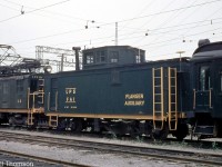 L&PS wooden flanger car FA1 is pictured in the yard at London ON, with electric freight motor L2 in 1954.