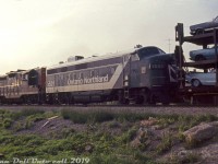 What was probably a unique catch in the area at the time, Ontario Northland FP7 1521 sports the recently applied green and white "progressive" livery as she trails CN GP9 4577 on CN freight #467 heading through Oakville in July 1967. Only three F-units ever wore this new short-lived livery applied in 1966: FP7's 1502, 1517 and 1521, which only lasted half a dozen years on the units. Two other ONR units, S2 1200 and RS3 1311, also received this scheme and wore it until retirement.<br><br><i>Reg Button photo, Dan Dell'Unto collection slide.</i><br><br><i>* Geotagged location not exact.</i>