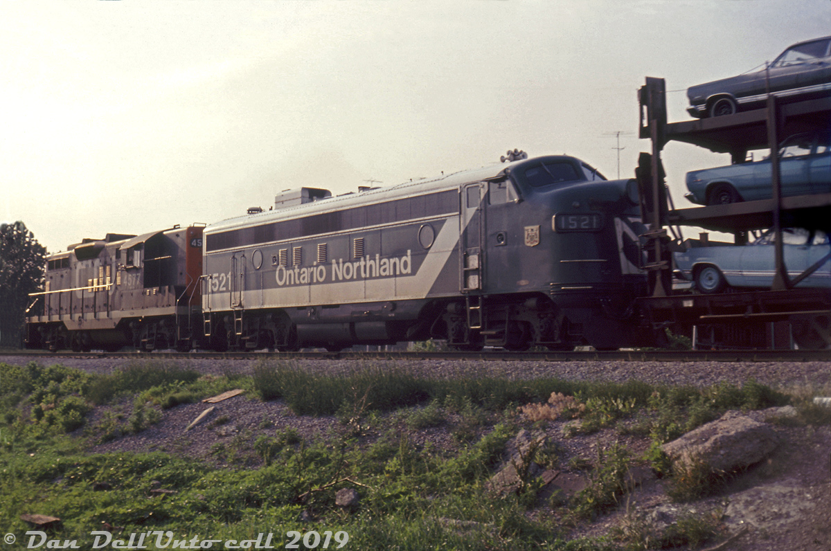 What was probably a unique catch in the area at the time, Ontario Northland FP7 1521 sports the recently applied green and white "progressive" livery as she trails CN GP9 4577 on CN freight #467 heading through Oakville in July 1967. Only three F-units ever wore this new short-lived livery applied in 1966: FP7's 1502, 1517 and 1521, which only lasted half a dozen years on the units. Two other ONR units, S2 1200 and RS3 1311, also received this scheme and wore it until retirement.Reg Button photo, Dan Dell'Unto collection slide.* Geotagged location not exact.