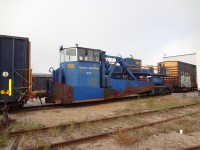 In contrast to Mr. Thomson's photo of Ontario Northland's Jordan spreader ONT 528 sandwiched between two boxcars at Cochrane, ON, here is sister machine ONT 529, sn 888, blt 1957, also a Type A, but with straight side wings, low front blade, and front operators cab. It is also sandwiched between two boxcars, only this one's in North Bay, ON.