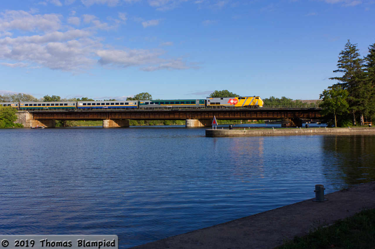 VIA 905 rolls across the Trent River in the warm sun of a summer evening.