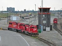 CP's Toronto Yard in Agincourt has a lot less track nowadays. <br>
This view from Finch Avenue bridge shows beltpack-controlled switching units CP 4407 (GP38-2) and CP 6308 (SD60-3), both of Soo Line heritage, at work below the East Pulldown Tower. <br>
Note the remains of the hump adjacent to the yard tower in the distance, and the weedy area left of it which formerly held tracks receiving cars off the hump. A CP plow is between the yard towers, last car in siding.