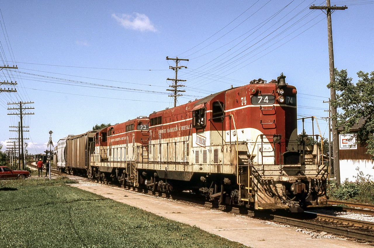 Peter Jobe photographed TH&B 74 and TH&B 73 switching in Smithville, Ontario at 1:40 P.M. on September 15, 1980.