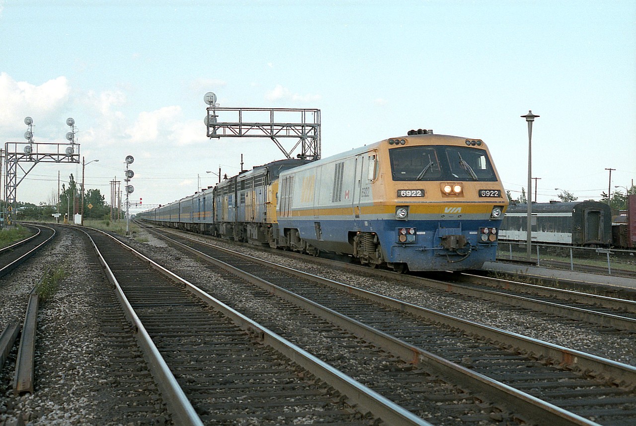Back in the 80s if we did not see something really good during the day, we could bank on the 1700 hr VIA #75 to make our days' trainwatching worthwhile. Here's a typical version stopped at the Burlington West station; well, not quite your every weekend typical as an LRC-3 had been tacked on the lead for some unknown reason. VIA 6922, 6777 and 6783 made for a nice catch.
On the left is the Halton sub, and on the right, the diminutive yard at Burlington. Both CN and CP switched industry there.
Yeah, I'll admit it. I hustled out on the RoW to grab this quick shot. But then, we had to cross all the tracks to get to our shooting location in the first place.
Sure would not try that now.