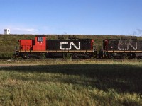 This is either a "Day in North America or West" shot. The relatively unique GMD-1's were either loved or hated - personally, I liked them.
They are pictured here by the Celanese plant, although it is hidden mostly by the earthen berm.