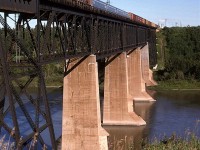 This is the conventional view of the bridge over the North Saskatchewan River in NE Edmonton. Probably the most interesting thing about this photo is the 4 passenger cars in tow. I have no info about them, however.