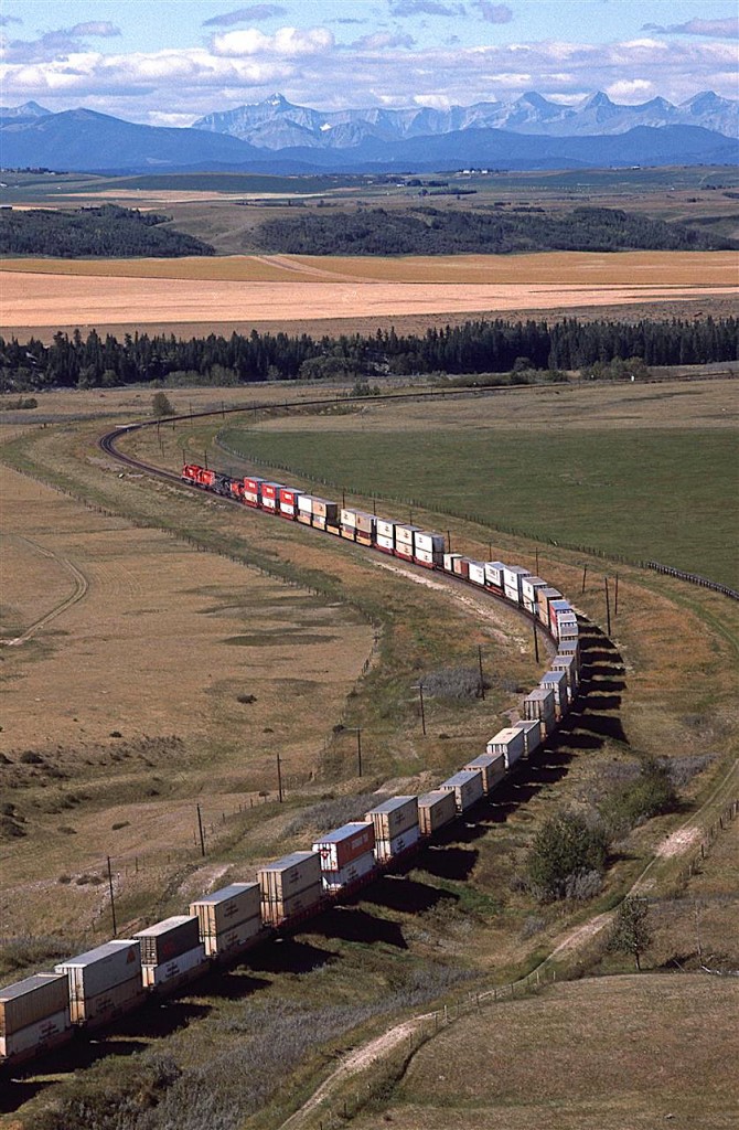 A view of the Bow River Valley to the Rockies. Apparently there was a small town here (furthest right, by the tracks), that operated the sandstone quarry and then a brick making operation. All of that closed down before WW1, and the place was abandoned. This side of the river is now Glenbow Ranch Provincial Park. In 1996, it was still an active ranch, with some crops.