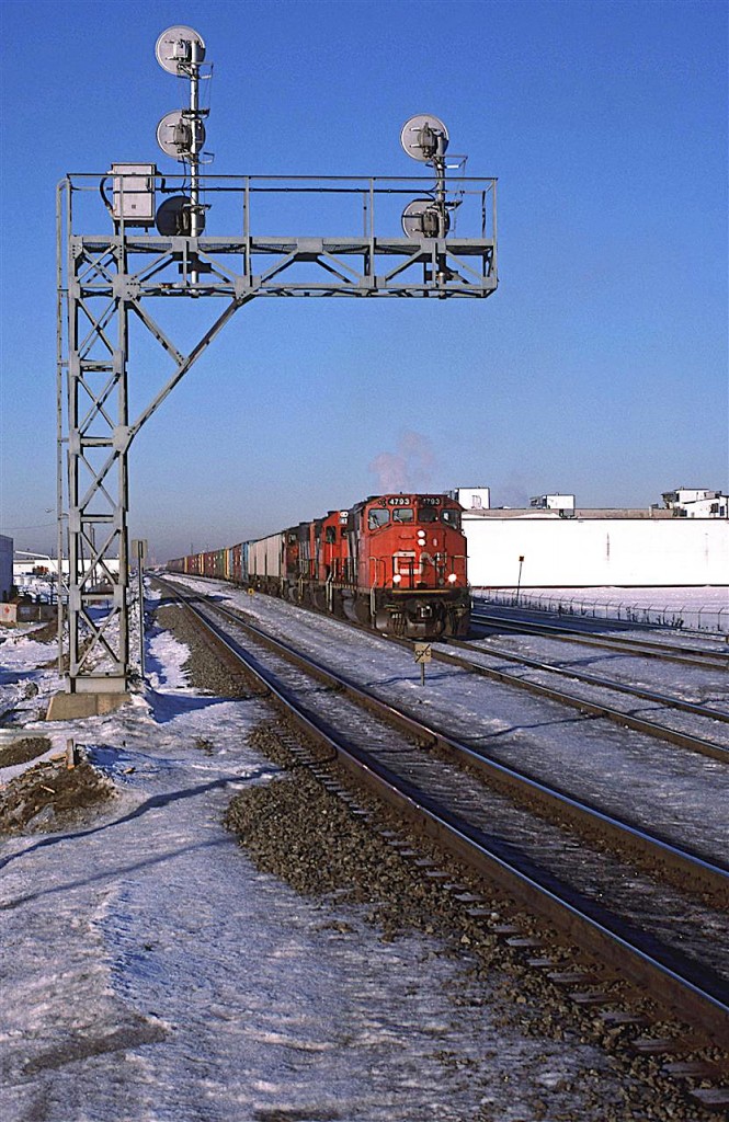 579 will travel up the Vegreville Syb, to St Paul Junction, where it will run up the Coronado sub to Kerensky where it will diverge onto the Lac LaBiche Sub. from there it will go to Boyle, where it will veer off again to go up the newish 24 mile AlPac Spur to switch out the OSB plant.
Here, it is leaving the easternmost tracks of Walker Yard. The leftmost track is the Walker Yard Bypass track. I think I see two such tracks on recent Google views.