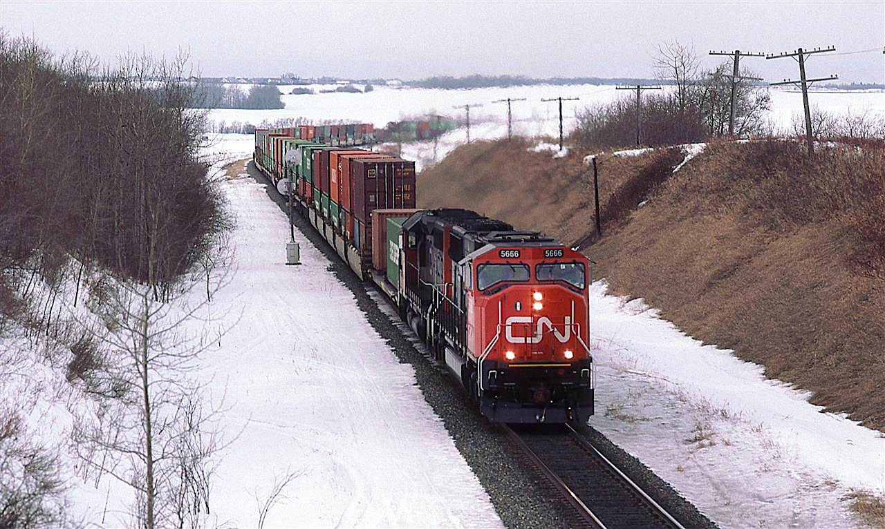 The new SD75I's seemed to be always leading. I don't even know if I ever saw one trailing. Granted, I left Canada in less than a year after taking this photo, and did not get back into CN territory until 2005.
This intermodal train may have been running late, because I rarely saw it in Edmonton, and virtually all of my railfanning was done in daylight.