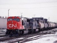 A very new 5707 and a LMS unit lead 413, a Scotford Yard (Fort Saskatchewan AB) to Vancouver train. Coming from Scotford, it is dominated by chemical traffic.
Seen here as it passes the Walker Shops.