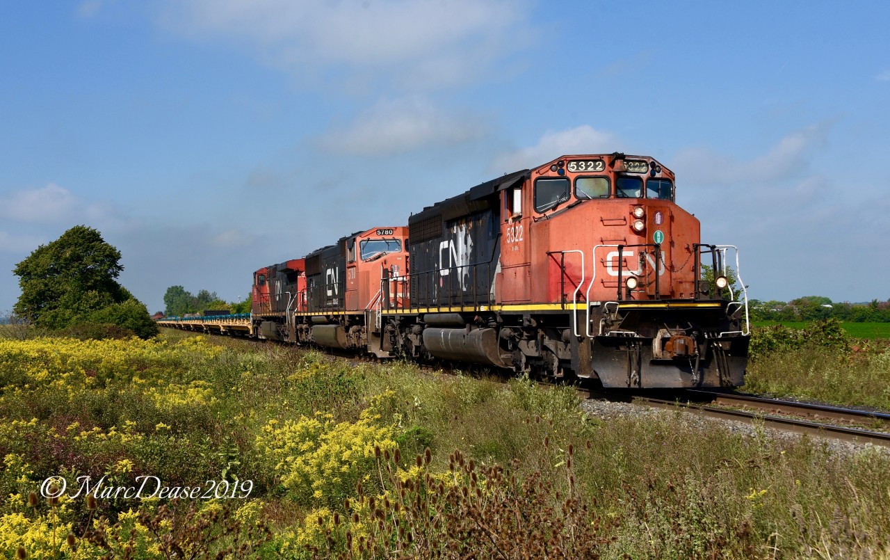 Thanks to a heads up from Joseph Bishop I was able o catch 509 heading back to London, ON., today. Here they pass Fairweather Sideroad with CN 5322 in the lead.