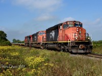 Thanks to a heads up from Joseph Bishop I was able o catch 509 heading back to London, ON., today. Here they pass Fairweather Sideroad with CN 5322 in the lead.