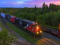 Running about 6-7 hours late, train 306 arrives at Gordon Yard at Moncton, New Brunswick at sunrise. CN 121 waits on the next track, and has the highball to leave once 306 pulls into the yard. 