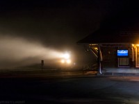 Well before sunrise, an SD70M-2 breaks the silence in the small university town of Sackville, New Brunswick. Seen here, heading by the VIA Rail depot, as they battle last little bit of fog in the area. 