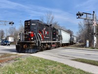 Having just crossed the bustling CN Halton moments ago and almost clear of bustling downtown Brampton, CCGX 4015 is seen carefully crossing over McMurchy ave southbound on this fine spring morning in April as they take 3 empties from Orangeville back to their owner, CP in Mississauga. Roughly 90min-2hrs later, 4015 will be seen returning northbound through downtown, only after having retrieved a handful of loaded freight cars from CP for delivery to the last 5-6 customers along this short line who rely on rail. Time is 09:52