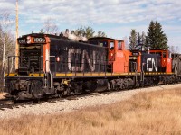 I first saw these engines going through Redwater cabhop with caboose 79669 at 10:30. There was a purpose of sending out 2 light GMD-1's today. Just 2 days earlier, I had watched a huge string of empty CN hoppers, headed for Edmonton, pass through Redwater (powered by GP38's). The hoppers were stored on the abandoned portion of the Lac La Biche Sub., which is accessed at Egremont. To now reach the remaining hoppers, ten hundreds will be needed on the old light rail. Here is the crew at 12:30, a few miles west of Redwater, with the last 65 CN hoppers en-route to Edmonton. It was a big looking train for 2 1000's, but 65 roller bearing empties shouldn't be much of a task. That is the 1079, ex NAR 302 Chief MoosToos, in behind. The new CN paint job still looking pretty fresh.