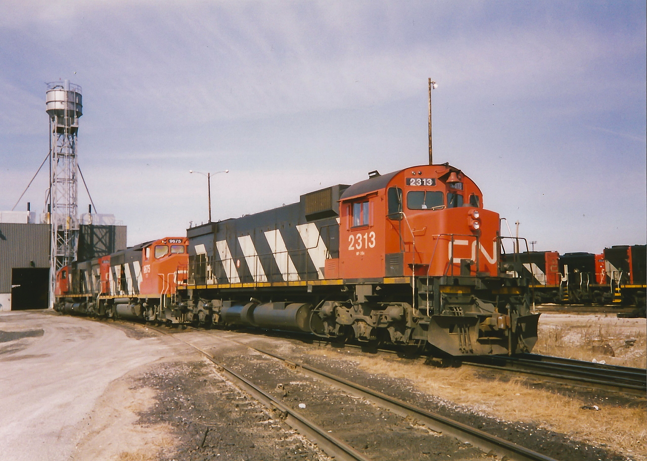 CN 2313, 9675 and 2031 have just been serviced at the MacMillan yard diesel shop and await a hostler to move them over to the departure tracks where they will eventually be assigned to an outbound train. 

Also, a big thank you to James Knott for assistance with editing this one.