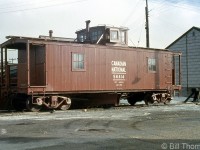 CN wooden flanger 56414 is shown parked on a siding by the freight shed near the station in Owen Sound in 1958. The "LU 11-56" stenciling on her sides below the weight denotes the shop code for London (LU) and November 1956. Like snowplows and Jordan spreaders, CN kept flangers stationed at various points across the system in order to clear snow and ice from between the flangeways. Most of CN's old flangers were home-built from wooden boxcars or flatcars, with flanger blades added between the trucks and a cupola on the roof for better operating crew visibility (lineside signs noted to crews when to raise the blades to clear obstructions present between the tracks like switches, bridge guides and railway crossings). <br><br>Their use diminished over time, and old wooden ones eventually gave way to newer flangers CN converted from steel boxcars. Many snowplows had their own sets of flanger blades mounted between the trucks under the body, or a hinged flanger tip at the front of the snowplow blade.