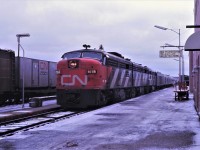 CN's westbound Panorama is shown arriving in Capreol, Ontario in October 1967.  It appears that winter made an early appearance in Northern Ontario that year.  Train 202, running many hours late, waits on track 2, for the Panorama's arrival.  Notice the number boards on the 6789, one is the standard white on black background and the other is reversed with black numbers on a white background.
