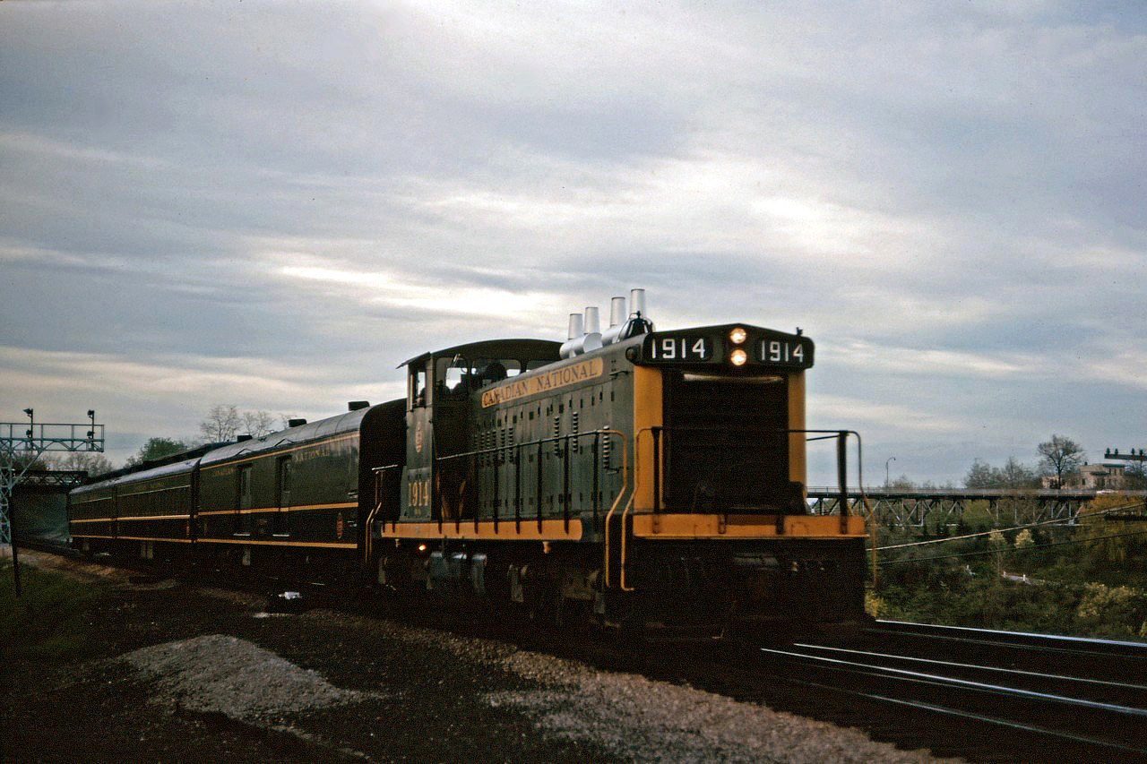 Prior to the advent of GO Transit in May 1967, CN operated two morning and two evening commuter trains between Toronto and Hamilton. Here we see one of the evening trains easing through Bayview on the home stretch to the James Street North station. GMD1s were regular power on these trains.