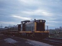 Prior to the advent of GO Transit in May 1967, CN operated two morning and two evening commuter trains between Toronto and Hamilton. Here we see one of the evening trains easing through Bayview on the home stretch to the James Street North station. GMD1s were regular power on these trains.