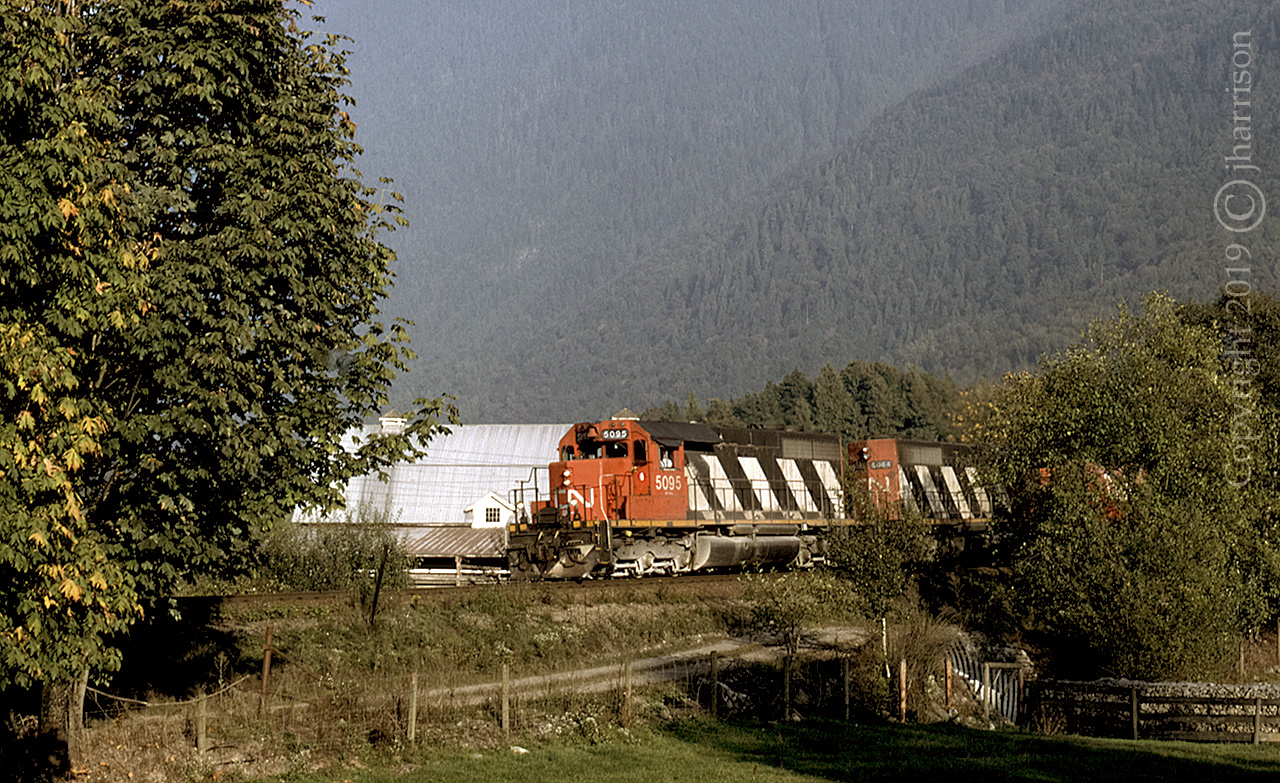CN 5095 and 5064, two GMD SD40's, are westbound at Cheam View on CN's Yale Sub.
