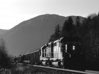 CN 5069, with the 6004 trailing, is hauling an eastbound empty coal train at SNS Arnold on CN's Yale Sub. 