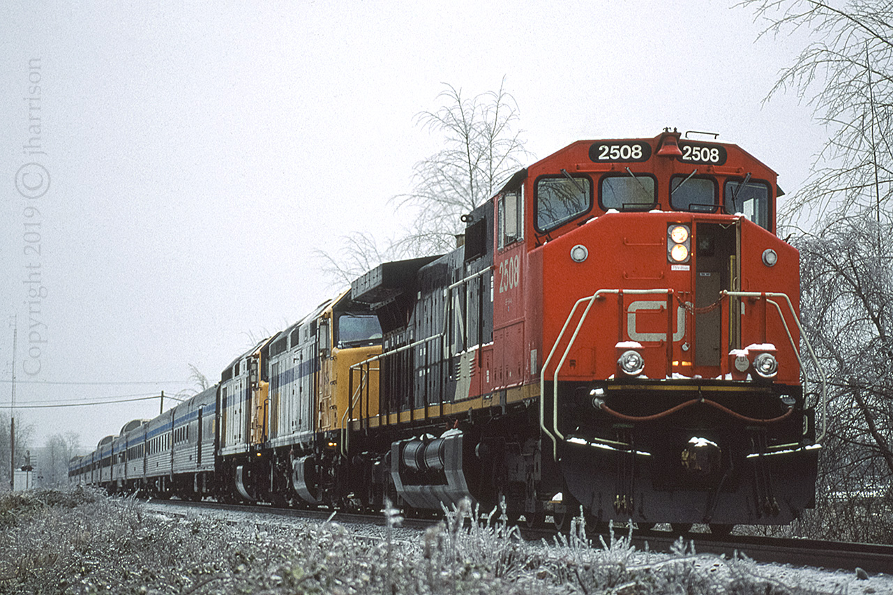 CN 2508 on what appears to be a rescue mission as it leads VIA #1 westward through the tail end of an ice storm at Rosedale on CN's Yale sub. The VIA units were #6454 and 6452.