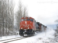 CN 2515, built in December of 1994, is just over a year old in this photo ... and with paint still intact. The 2405 is trailing as they roll through Rosedale on CN's Yale Sub.