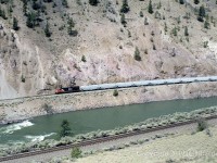 CN 3819 is westbound as it follows the Thompson River at Seddall on CN's Ashcroft Sub. Taken from across the river on CP's Thompson Sub and about half way between Spences Bridge and Lytton. GPS is approximate.  