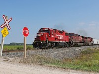 Charging westward for the border, CP 3035 heads up train 235 at mile 90.8 on the CP's Windsor Sub. Trailing are CP 8629 and 8509.