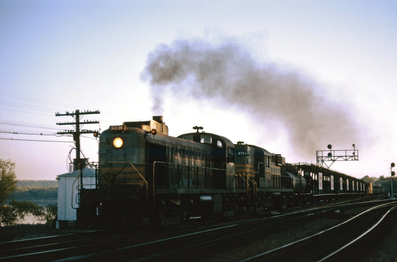 Veteran RS2 8406 leads an eastbound CP freight through Bayview at dusk...The 8406 was one of four MLW built RS2s on the CP roster, originally built in November 1950 as part of the program for dieselization of the Schreiber Division in northern Ontario. She survived the trade-ins for C424s in the mid-1960s but suffered an electrical fire in 1969 and was scrapped at Angus shops in 1970 (source: Canadian Pacific Diesel Power book by Murray Dean and David Hanna).